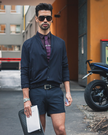 MILAN, ITALY - JUNE 23  People gather outside Armani fashion shows building for Milan Men Fashion Week on JUNE 23, 2014 in Milan のeditorial素材