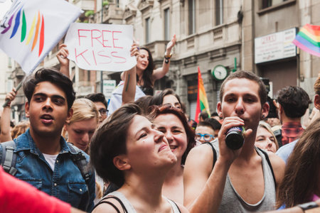 MILAN, ITALY - JUNE 28: People at gay pride parade in Milan JUNE 28, 2014. Thousands of people march in the city streets for the annual gay pride parade, claiming equality and legal rights. のeditorial素材
