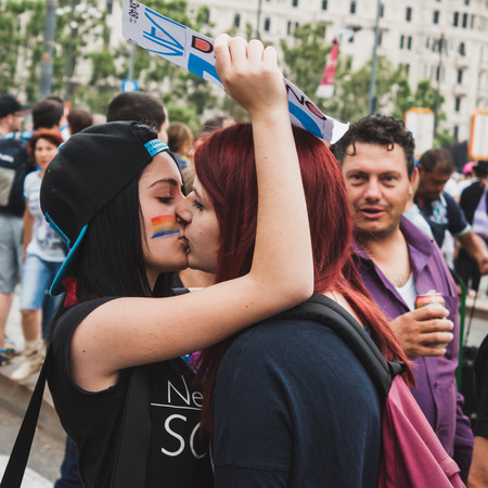 MILAN, ITALY - JUNE 28: People at gay pride parade in Milan JUNE 28, 2014. Thousands of people march in the city streets for the annual gay pride parade, claiming equality and legal rights. のeditorial素材