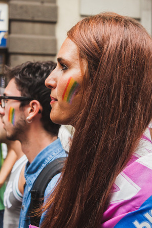MILAN, ITALY - JUNE 28: People at gay pride parade in Milan JUNE 28, 2014. Thousands of people march in the city streets for the annual gay pride parade, claiming equality and legal rights. のeditorial素材