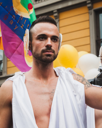 MILAN, ITALY - JUNE 28: People at gay pride parade in Milan JUNE 28, 2014. Thousands of people march in the city streets for the annual gay pride parade, claiming equality and legal rights. のeditorial素材