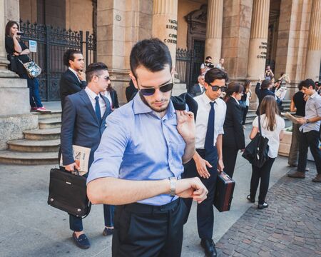 MILAN, ITALY - JULY 16: Business people take part in a flash mob to promote the official launch of The Wolf of Wall Street on DVD and Blue-Ray on July 16, 2014 in Milan.のeditorial素材