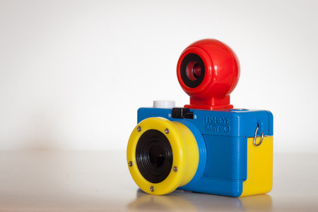 MILAN, ITALY - AUGUST 7, 2014  Closeup of Fisheye Baby 110 Bauhaus camera produced by Lomography, commercial trademark of Lomographische AG, an Austrian company famous for its analog cameras and accessories のeditorial素材