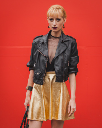 MILAN, ITALY - SEPTEMBER 18: Woman poses outside Costume National fashion shows building for Milan Women's Fashion Week on SEPTEMBER 18, 2014 in Milan.のeditorial素材