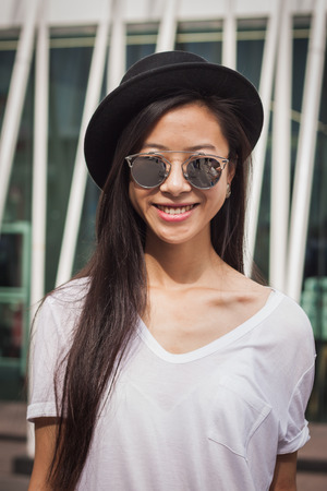 MILAN, ITALY - SEPTEMBER 20: Woman poses outside Jil Sander fashion shows building for Milan Women's Fashion Week on SEPTEMBER 20, 2014 in Milan.のeditorial素材