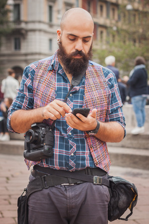 MILAN, ITALY - SEPTEMBER 20: Photographer outside Cavalli fashion shows building for Milan Women's Fashion Week on SEPTEMBER 20, 2014 in Milan.のeditorial素材