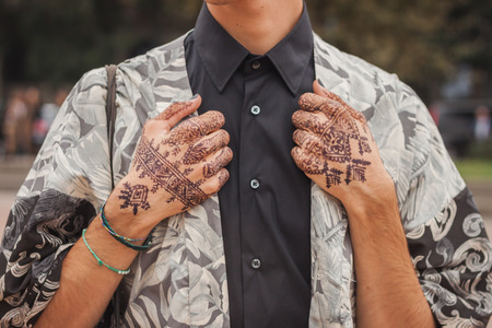 MILAN, ITALY - SEPTEMBER 20: Man poses outside Cavalli fashion shows building for Milan Women's Fashion Week on SEPTEMBER 20, 2014 in Milan.のeditorial素材