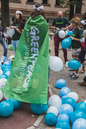 MILAN, ITALY - OCTOBER 4: People take part in the Ice Ride, global bike event organized by Greenpeace to demand protection for the Arctic on OCTOBER 4, 2014 in Milan.のeditorial素材