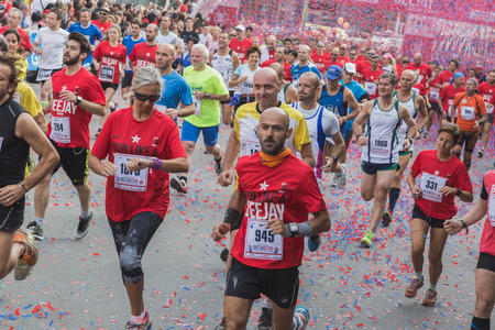 MILAN, ITALY - OCTOBER 5: Athletes take part in Deejay Ten, running event organized by Deejay Radio through the city streets on OCTOBER 5, 2014 in Milan.のeditorial素材