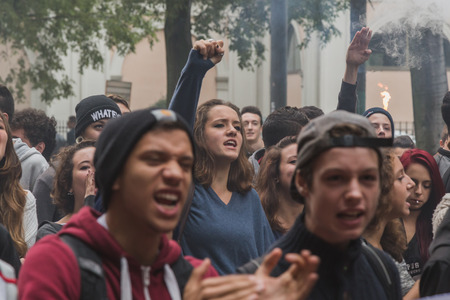 MILAN, ITALY - OCTOBER 10: Thousands of students march in the city streets to protest agaist the money cuts in the public school on OCTOBER 10, 2014 in Milan.のeditorial素材