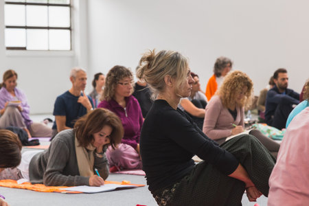 MILAN, ITALY - OCTOBER 10: People take a class at Yoga Festival, event dedicated to yoga, meditation...