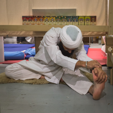 MILAN, ITALY - OCTOBER 10: Yogi practicing at Yoga Festival, event dedicated to yoga, meditation and healthy lifestyle on OCTOBER 10, 2014 in Milan.のeditorial素材