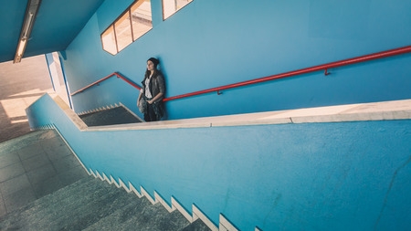 Pretty girl with beanie posing in a metro stationの写真素材