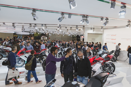 MILAN, ITALY - NOVEMBER 5: People visit EICMA, international motorcycle exhibition on NOVEMBER 5, 2014 in Milan.のeditorial素材