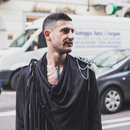 MILAN, ITALY - JANUARY 18: People gather outside John Richmond fashion show building for Milan Men's Fashion Week on JANUARY 18, 2015 in Milan.のeditorial素材