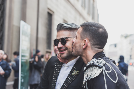 MILAN, ITALY - JANUARY 18: People gather outside John Richmond fashion show building for Milan Men's Fashion Week on JANUARY 18, 2015 in Milan.のeditorial素材