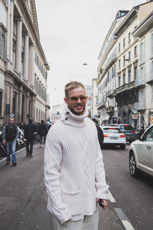 MILAN, ITALY - JANUARY 18: People gather outside John Richmond fashion show building for Milan Men's Fashion Week on JANUARY 18, 2015 in Milan.のeditorial素材
