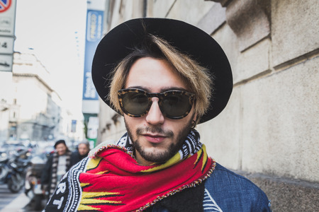 MILAN, ITALY - JANUARY 18: People gather outside John Richmond fashion show building for Milan Men's Fashion Week on JANUARY 18, 2015 in Milan.のeditorial素材