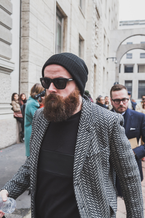 MILAN, ITALY - JANUARY 18: People gather outside Ferragamo fashion show building for Milan Men's Fashion Week on JANUARY 18, 2015 in Milan.のeditorial素材