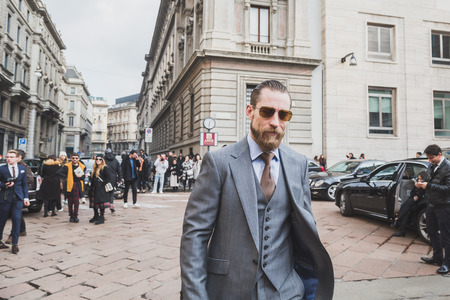 MILAN, ITALY - JANUARY 18: People gather outside Ferragamo fashion show building for Milan Men's Fashion Week on JANUARY 18, 2015 in Milan.のeditorial素材
