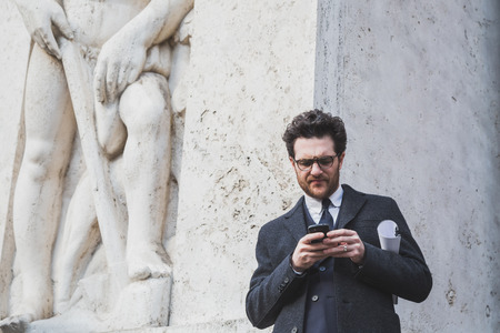MILAN, ITALY - JANUARY 18: People gather outside Ferragamo fashion show building for Milan Men's Fashion Week on JANUARY 18, 2015 in Milan.のeditorial素材
