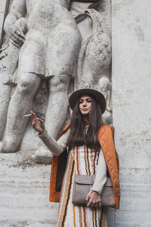MILAN, ITALY - JANUARY 18: People gather outside Ferragamo fashion show building for Milan Men's Fashion Week on JANUARY 18, 2015 in Milan.のeditorial素材