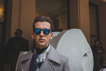 MILAN, ITALY - JANUARY 18: People gather outside Vivienne Westwood fashion show building for Milan Men's Fashion Week on JANUARY 18, 2015 in Milan.のeditorial素材