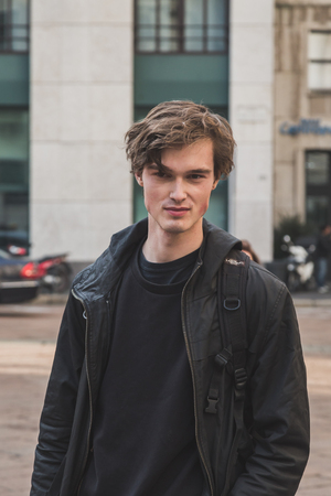 MILAN, ITALY - JANUARY 18: Beautiful model outside Ferragamo fashion show building for Milan Men's Fashion Week on JANUARY 18, 2015 in Milan.のeditorial素材
