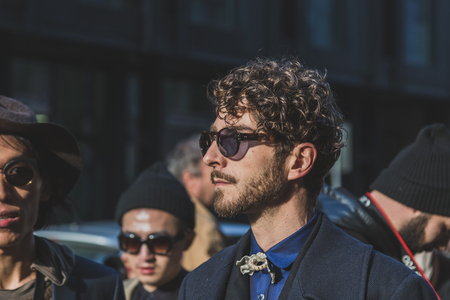 MILAN, ITALY - JANUARY 18: People gather outside Vivienne Westwood fashion show building for Milan Men's Fashion Week on JANUARY 18, 2015 in Milan.のeditorial素材