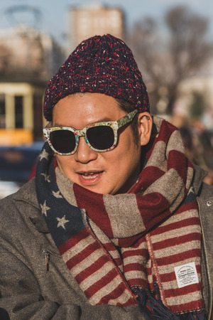 MILAN, ITALY - JANUARY 18: People gather outside Vivienne Westwood fashion show building for Milan Men's Fashion Week on JANUARY 18, 2015 in Milan.のeditorial素材