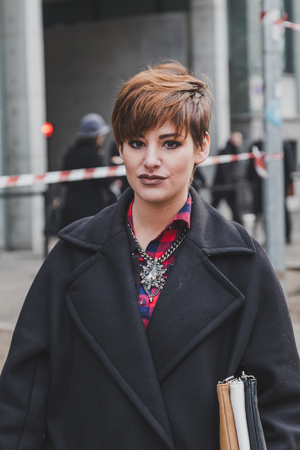 MILAN, ITALY - JANUARY 19: People gather outside Armani fashion show building for Milan Men's Fashion Week on JANUARY 19, 2015 in Milan.のeditorial素材
