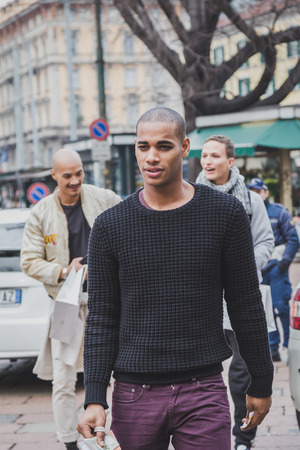 MILAN, ITALY - JANUARY 19: People gather outside Gucci fashion show building for Milan Men's Fashion Week on JANUARY 19, 2015 in Milan.のeditorial素材