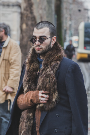 MILAN, ITALY - JANUARY 19: People gather outside Gucci fashion show building for Milan Men's Fashion Week on JANUARY 19, 2015 in Milan.のeditorial素材