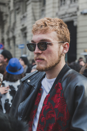 MILAN, ITALY - JANUARY 19: People gather outside Gucci fashion show building for Milan Men's Fashion Week on JANUARY 19, 2015 in Milan.のeditorial素材