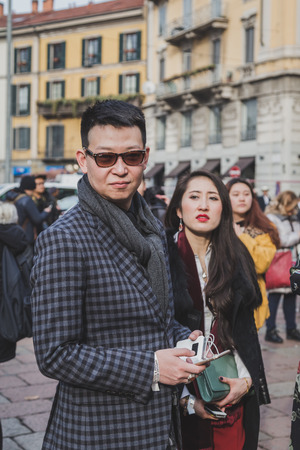 MILAN, ITALY - JANUARY 19: People gather outside Gucci fashion show building for Milan Men's Fashion Week on JANUARY 19, 2015 in Milan.のeditorial素材