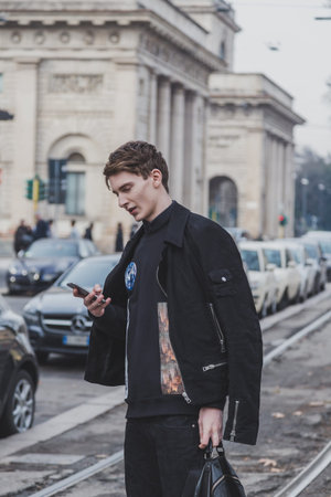 MILAN, ITALY - JANUARY 19: Beautiful model outside Gucci fashion show building for Milan Men's Fashion Week on JANUARY 19, 2015 in Milan.のeditorial素材