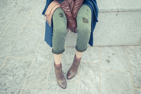 Detail of a stylish young woman posing in the city streetsの写真素材