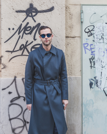 MILAN, ITALY - JANUARY 20: People gather outside Dirk Bikkembergs fashion show building for Milan Men's Fashion Week on JANUARY 20, 2015 in Milan.のeditorial素材