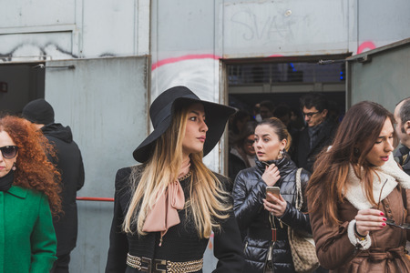 MILAN, ITALY - JANUARY 20: People gather outside Dirk Bikkembergs fashion show building for Milan Men's Fashion Week on JANUARY 20, 2015 in Milan.のeditorial素材