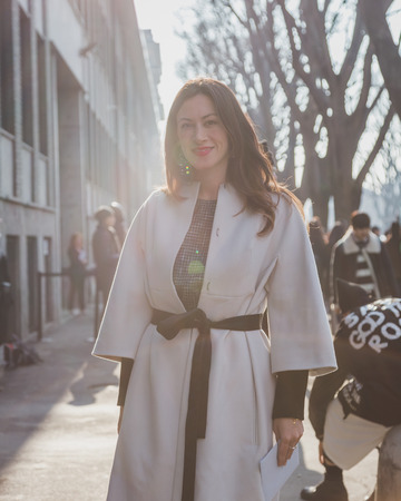 MILAN, ITALY - JANUARY 20: People gather outside Armani fashion show building for Milan Men's Fashion Week on JANUARY 20, 2015 in Milan.のeditorial素材
