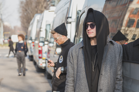 MILAN, ITALY - JANUARY 20: People gather outside Armani fashion show building for Milan Men's Fashion Week on JANUARY 20, 2015 in Milan.のeditorial素材