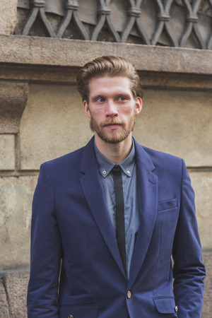MILAN, ITALY - JANUARY 20: People gather outside Cavalli fashion show building for Milan Men's Fashion Week on JANUARY 20, 2015 in Milan.のeditorial素材