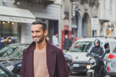 MILAN, ITALY - JANUARY 20: People gather outside Cavalli fashion show building for Milan Men's Fashion Week on JANUARY 20, 2015 in Milan.のeditorial素材