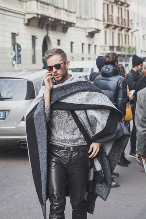 MILAN, ITALY - JANUARY 20: People gather outside Cavalli fashion show building for Milan Men's Fashion Week on JANUARY 20, 2015 in Milan.のeditorial素材