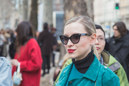 MILAN, ITALY - FEBRUARY 25: People gather outside Gucci fashion show building for Milan Women's Fashion Week on FEBRUARY 25, 2015  in Milan.のeditorial素材