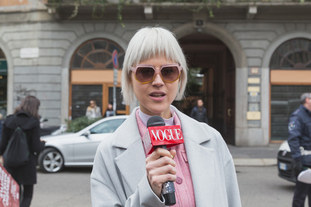 MILAN, ITALY - FEBRUARY 25: People gather outside Gucci fashion show building for Milan Women's Fashion Week on FEBRUARY 25, 2015  in Milan.のeditorial素材