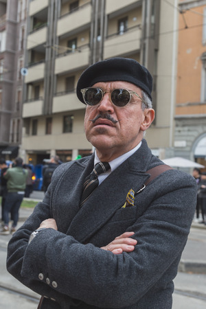 MILAN, ITALY - FEBRUARY 25: People gather outside Gucci fashion show building for Milan Women's Fashion Week on FEBRUARY 25, 2015  in Milan.のeditorial素材
