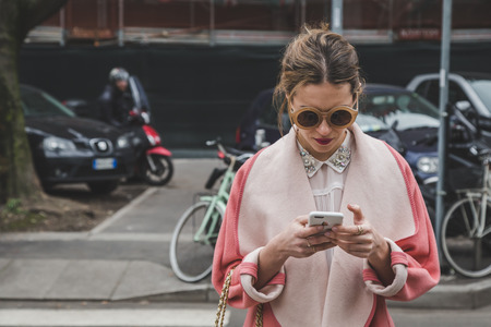 MILAN, ITALY - FEBRUARY 27: People gather outside Armani fashion show building for Milan Women's Fashion Week on FEBRUARY 27, 2015  in Milan.のeditorial素材