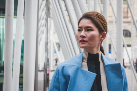 MILAN, ITALY - FEBRUARY 28: People gather outside Jil Sander fashion show building for Milan Women's Fashion Week on FEBRUARY 28, 2015  in Milan.のeditorial素材