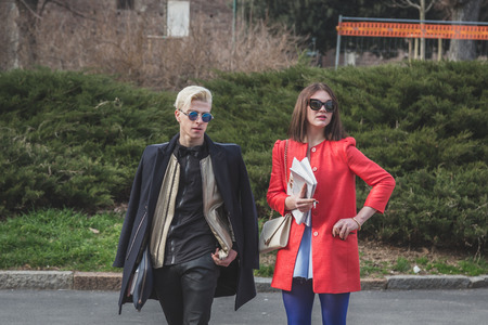 MILAN, ITALY - FEBRUARY 28: People gather outside Jil Sander fashion show building for Milan Women's Fashion Week on FEBRUARY 28, 2015  in Milan.のeditorial素材